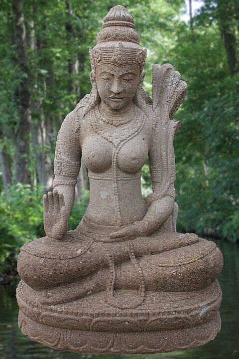 This is the stone figure of Dewi Sri Abhaya Mudra, an Indonesian rice goddess of fertility. The sculpture consists of the natural stone Rhyolih and was handcrafted in Java (Indonesia).