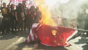 APEC Summit Interrupted In Peru As Protesters Burn US Flag 1